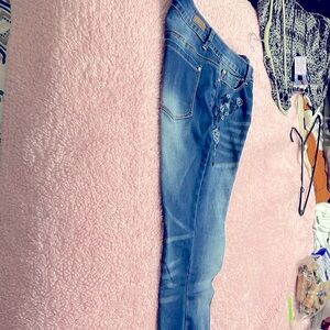 In great condition never been worn embroidery on the right side. They are nice.